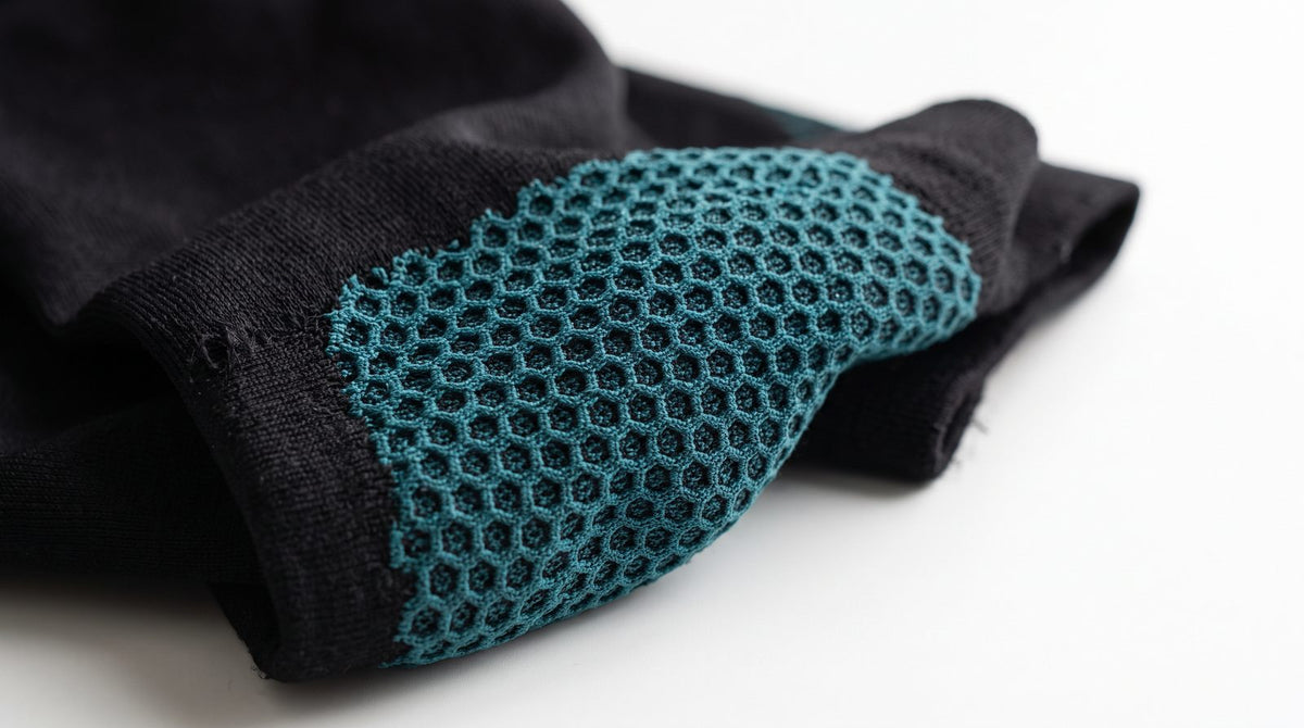Close-up of the teal honeycomb shaping knit